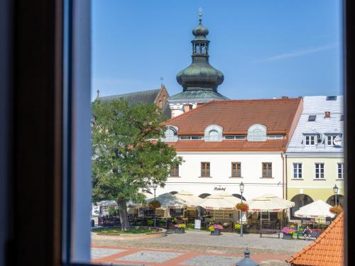 a view of a building with a tower on top at The Old Townhouse III in Krosno