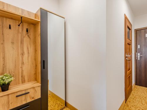 a pivot door in the hallway of a house at The Old Townhouse III in Krosno
