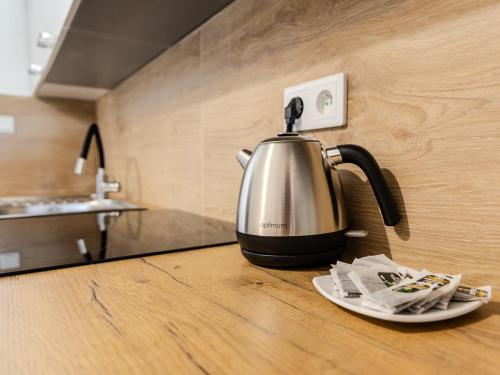 a tea kettle sitting on a counter in a kitchen at The Old Townhouse III in Krosno