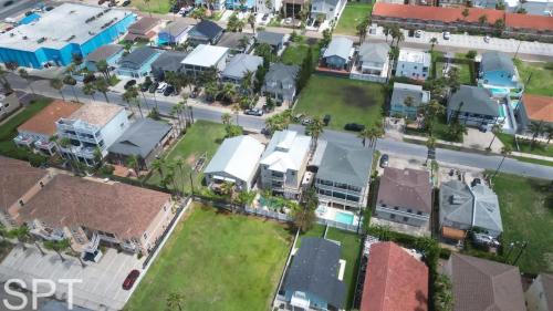 an aerial view of a small town with houses at Luxury Remodel - Sleeps 20 - Pool - Go VIP in South Padre Island
