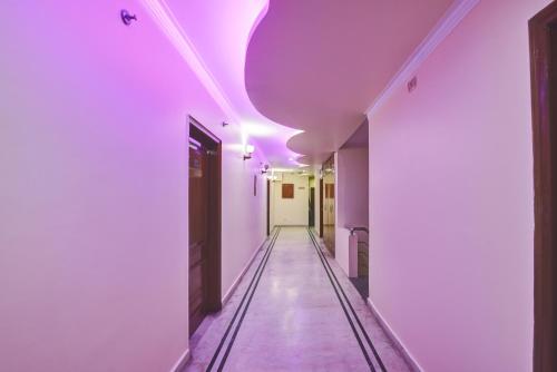 a corridor with purple lighting in a hallway at Hotel Gracious - Civil Line in Gurgaon