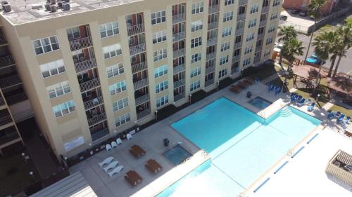 an overhead view of a large building with a swimming pool at Gulfview II #604 in South Padre Island
