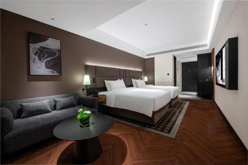 Cama o camas de una habitación en 深圳南山万科云城城际酒店