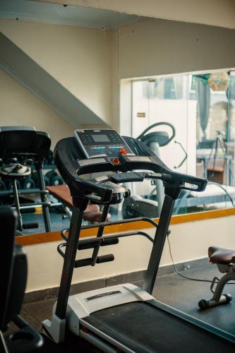 a gym with two treadmills and a treadmill at Morning Side Suites in Lagos