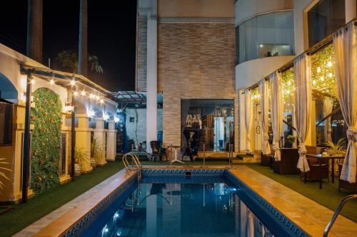 a swimming pool in a house at night at Morning Side Suites in Lagos