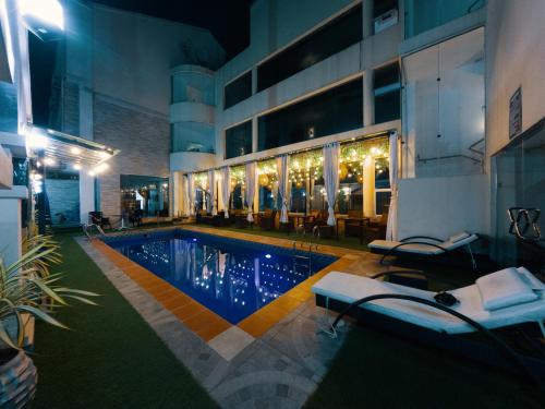 a swimming pool in the middle of a building at Morning Side Suites in Lagos