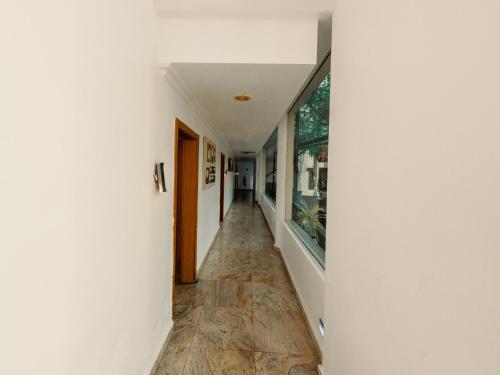 a hallway of a house with a floor to ceiling window at Morning Side Suites in Lagos