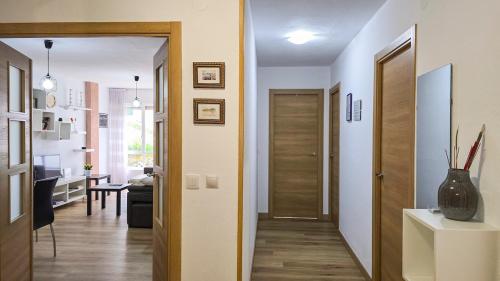 a hallway with a door leading to a living room at Casa Taro San Vicente de la Barquera in San Vicente de la Barquera