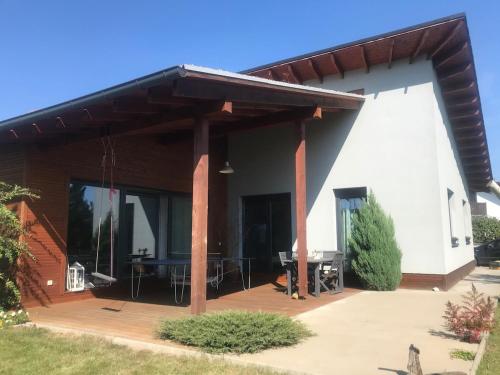 a pavilion with a table on a patio at Family house in Pardubice
