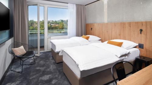 Ein Bett oder Betten in einem Zimmer der Unterkunft OREA Congress Hotel Brno