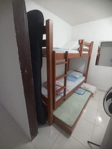 a group of bunk beds in a room at Casa Simples in Bonito