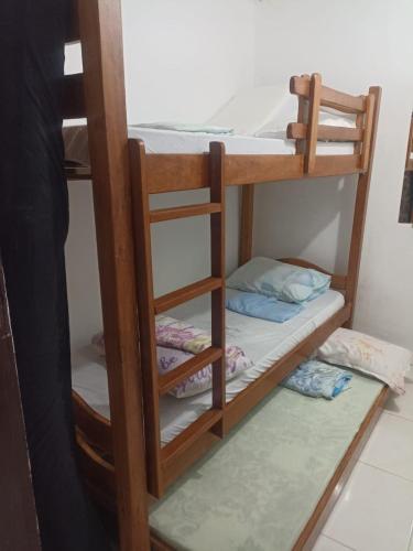 a couple of bunk beds in a room at Casa Simples in Bonito