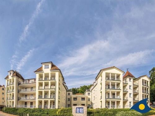 a large apartment building with a blue sky in the background at Villa Margot Whg 30 in Bansin