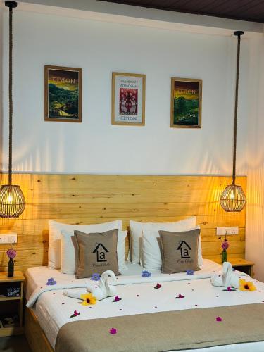 a bedroom with a large bed with flowers on it at La Casa Bella in Ella