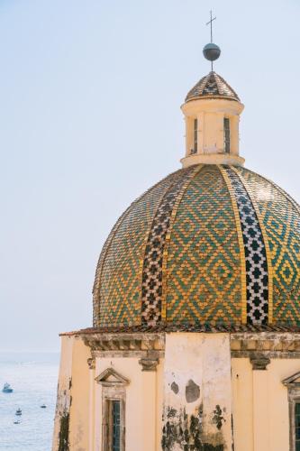 a building with a dome on top of it at Dimora Donna Teresa in Positano