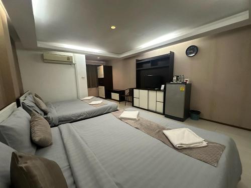 Кровать или кровати в номере House Of Pattaya