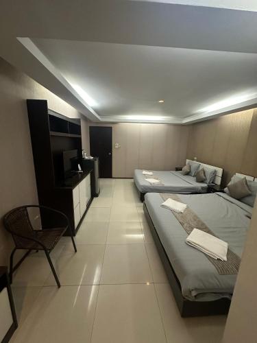 Кровать или кровати в номере House Of Pattaya