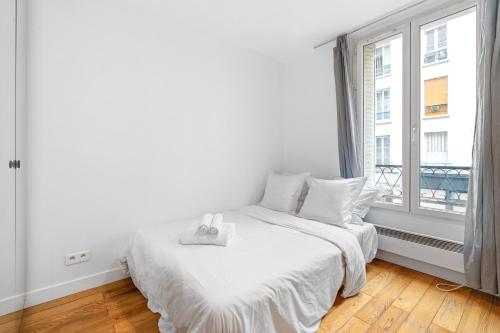 Postel nebo postele na pokoji v ubytování Montmartre - Élégance & Charme au pied Sacré-Cœur