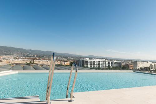 a swimming pool on the roof of a building at Hotel Mezquita Center in Córdoba
