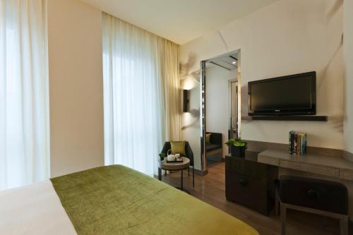 TV a/nebo společenská místnost v ubytování Starhotels Echo