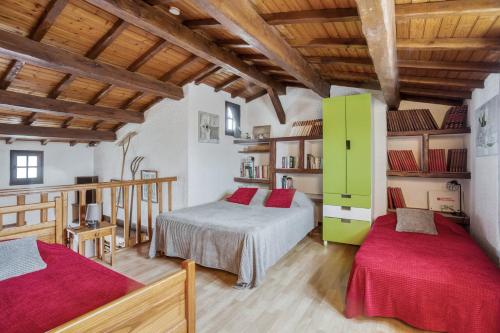 Ένα ή περισσότερα κρεβάτια σε δωμάτιο στο Maison Am Stram Gram