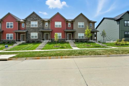 a row of houses in a residential neighborhood at Modern Townhome Retreat in Prime Location townhouse in Coralville