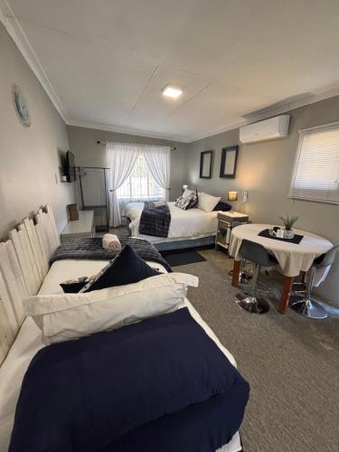 Ένα ή περισσότερα κρεβάτια σε δωμάτιο στο Stellies Accommodation - Room 1