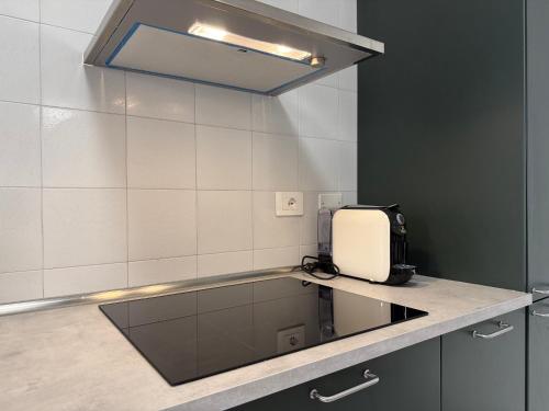 a kitchen with a appliance on a counter top at Girasole Guest House in Verona
