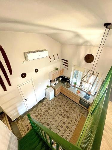 an overhead view of a living room with a couch at Authentic apartments with jacuzzi and Two-level central Haifa in Haifa