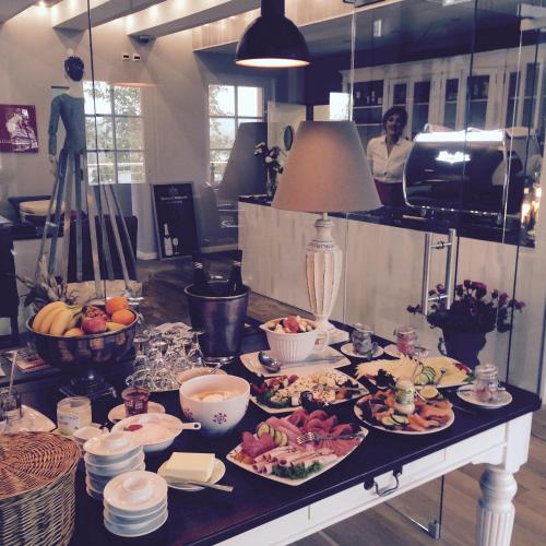 a table with many plates of food on it at Seehotel Lichtenberg in Lichtenberg