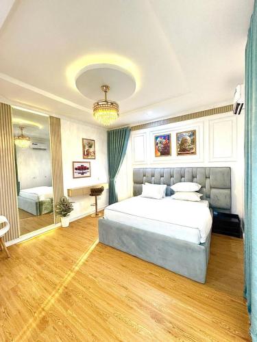 a bedroom with a large bed in a room at Spacious 2bed apartment in Abuja