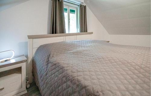 Ferienhaus In Ruhiger Lageにあるベッド