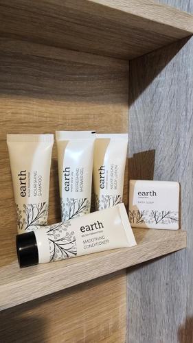 a shelf with four products sitting on it at Springdale Villa in Kodaikānāl