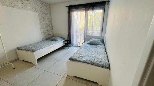 Ένα ή περισσότερα κρεβάτια σε δωμάτιο στο Neuhofen Stay