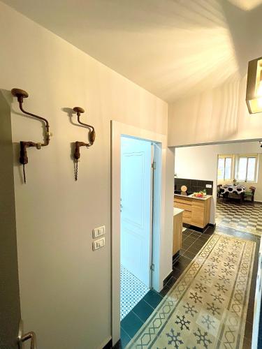 a hallway with a door leading to a kitchen at Authentic apartments with jacuzzi and Two-level central Haifa in Haifa