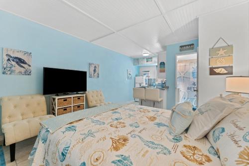 Кровать или кровати в номере Tropic Terrace Suite #12 - Beachfront Resort