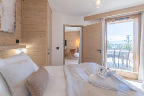 Alpe d'Huez Houses - Chez Côme, Nid douillet dans résidence Spa 5 étoiles, skis au pied, avec vue et jardin photo 2