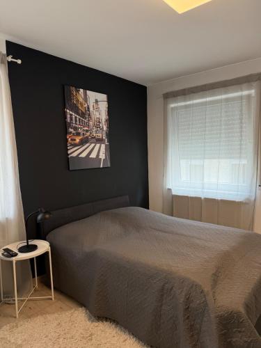 Кровать или кровати в номере Urban City Room Bad Nauheim
