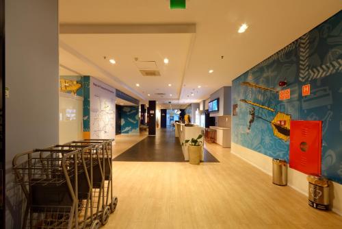 a hallway of an office with tables and chairs at Golden Tower Express Anhembi by Fênix Hotéis in Sao Paulo