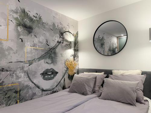a bedroom with a mirror and a bed at T25 Urban Green Hideaway in Budapest