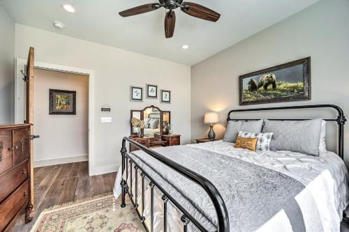 a bedroom with a bed and a ceiling fan at On 22 Acres Cullowhee Craftsman Home with Mtn Views in Cullowhee