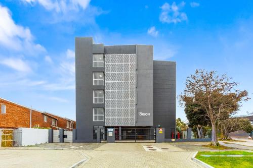 a building with a lot of windows on it at The Orion 18 by Host Agents in Table View