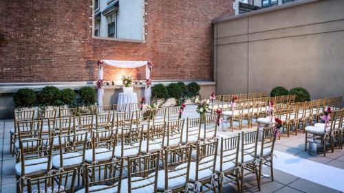 an image of a wedding ceremony in the courtyard of a building at Sofitel New York in New York
