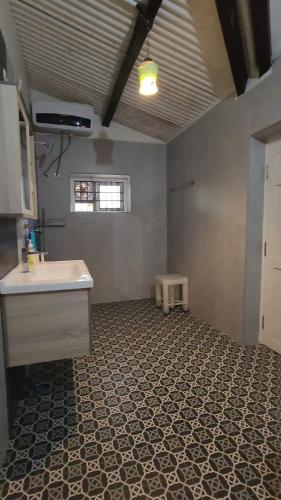a kitchen with a sink and a counter in a room at Springdale Villa in Kodaikānāl