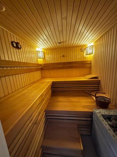 a sauna with a bed and lights in it at Dar NFis Suites et chambres de luxe dans un havre de paix vue paradisiaque au bord du lac in Lalla Takerkoust