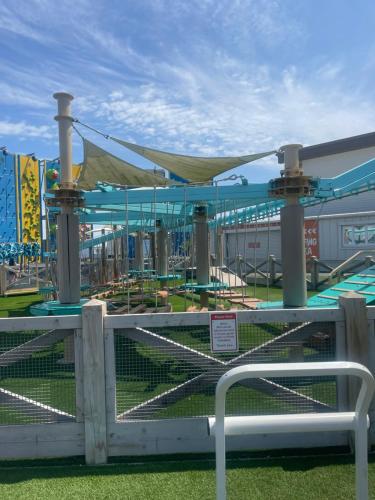 a ride at an amusement park with a roller coaster at Luxury Family Caravan With Decking and Sea View - Sleeps 6 in Allhallows