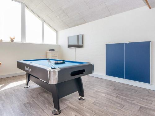 a pool table in the middle of a room at 12 person holiday home in Harboøre-By Traum in Harboør