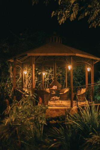 a gazebo lit up at night with lights at Pousada Sítio Ipê in Viçosa do Ceará