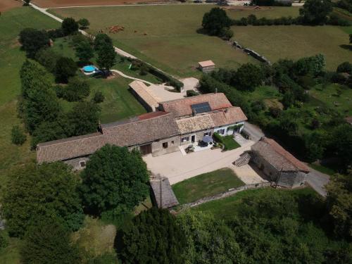an overhead view of an old house with a yard at Les Gîtes de la Roche Élie in Rom
