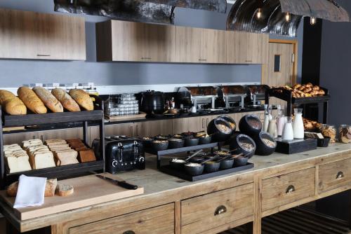 a bakery with bread and other items on display at Fosshotel Nupar in Kálfafell